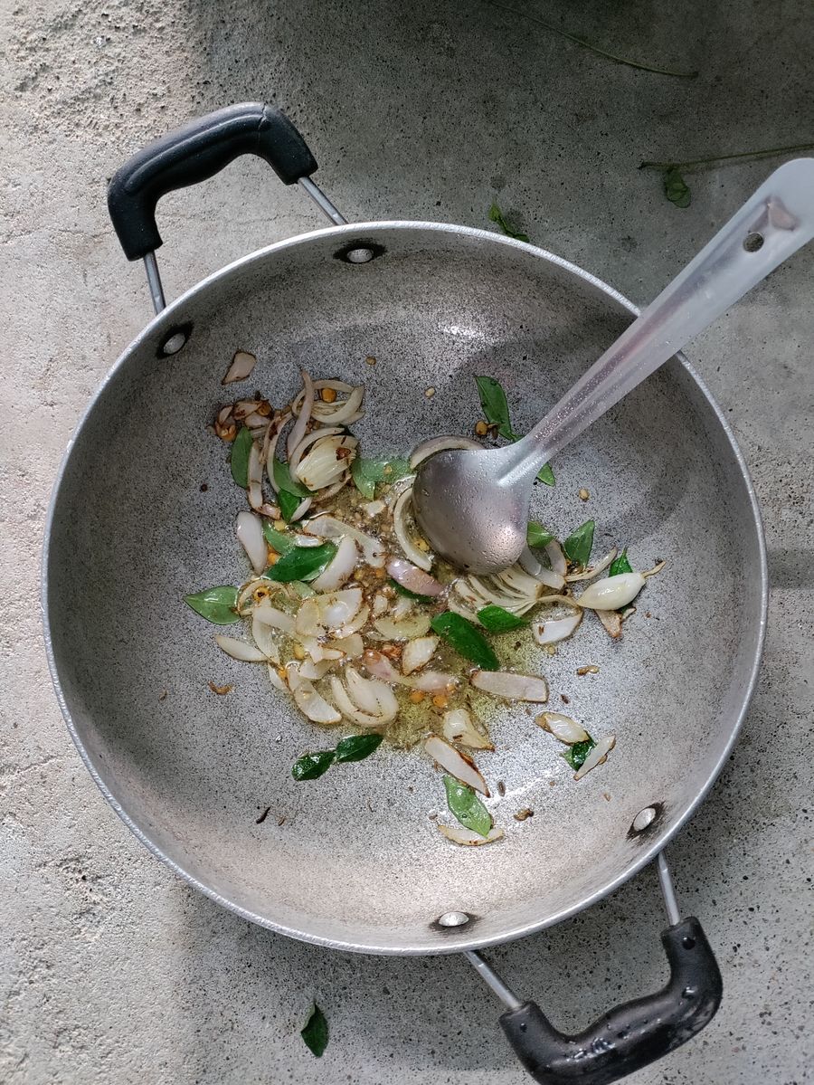 Traditional tempering being prepared in a kadai